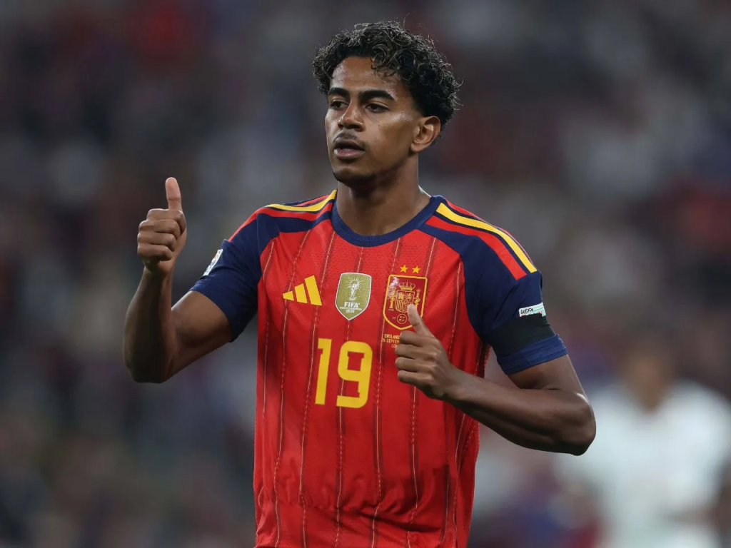 Spain player Lamine Yamal, wearing No. 19, giving a thumbs-up gesture during the match against England.