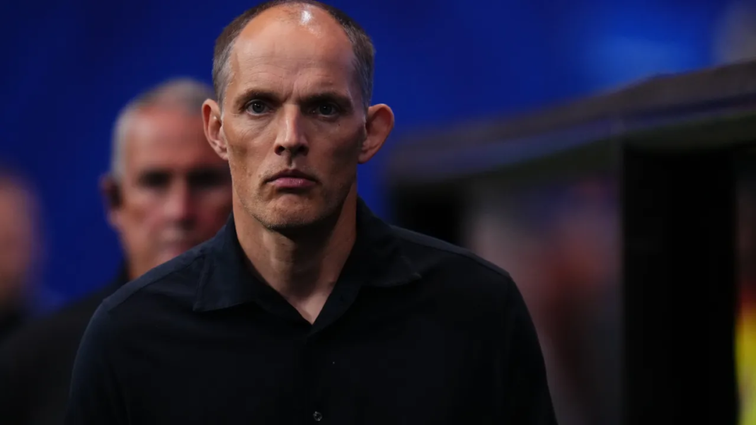 England head coach Thomas Tuchel looking serious in a dark shirt before a match.