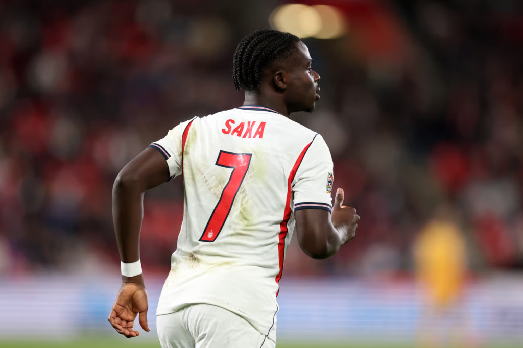 Bukayo Saka runs wearing England’s number seven shirt.