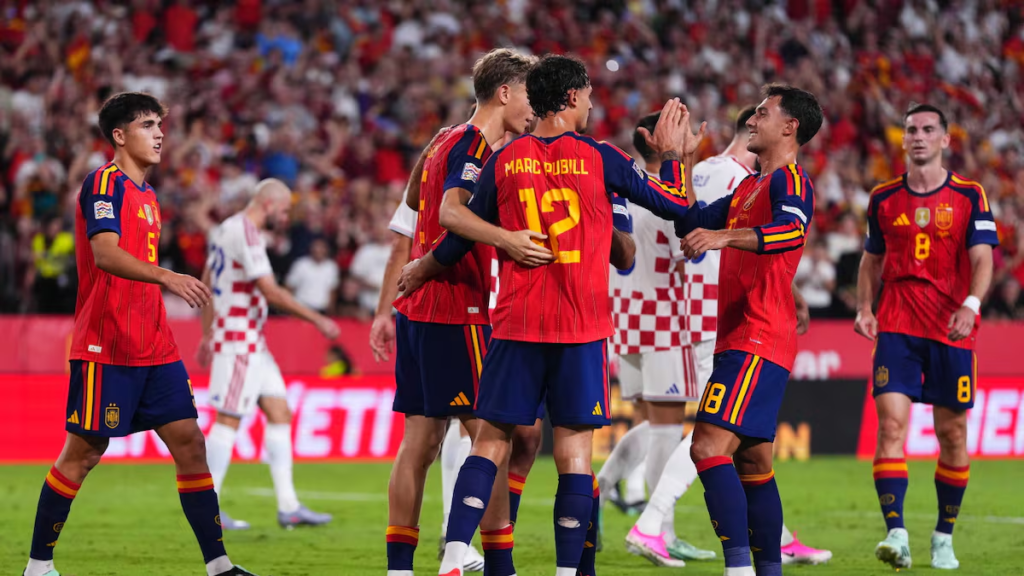 Marc Pubill celebrates with Spain teammates against Croatia.