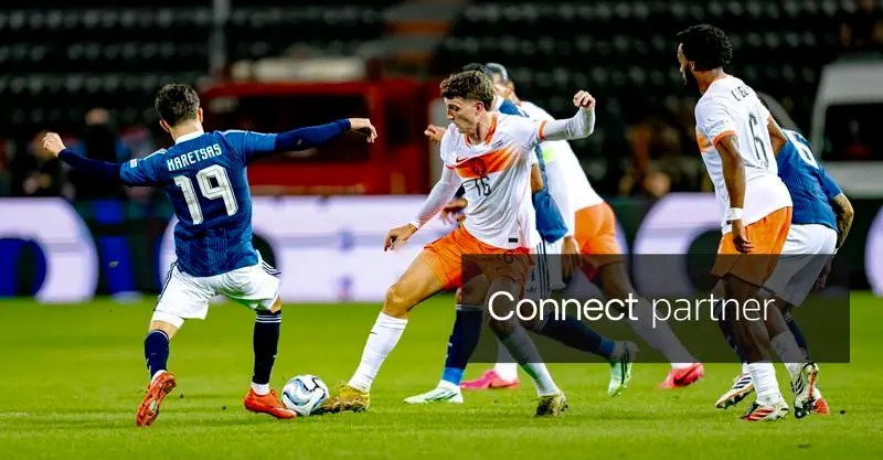 Greek forward Konstantinos Karetsas and Dutch midfielder Guus Til challenging for the ball during the UEFA Nations League match at Toumba Stadium, Thessaloniki.