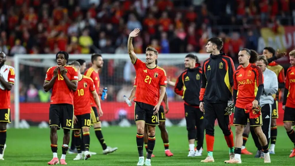 Belgium players, including No. 21 waving to the crowd, applauding fans after their win over Türkiye.