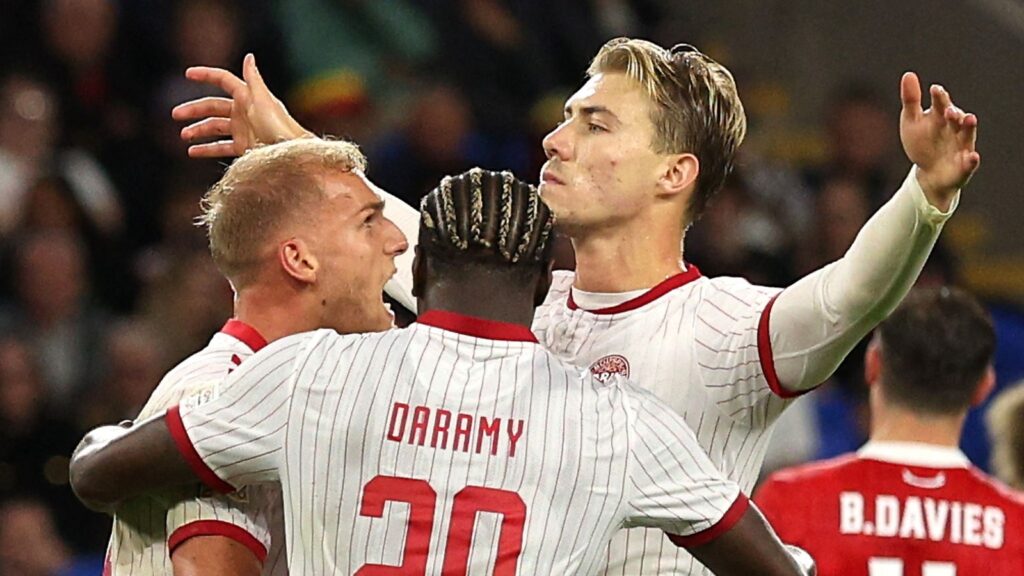 Denmark forward Rasmus Højlund celebrating after scoring the winning goal in Cardiff.