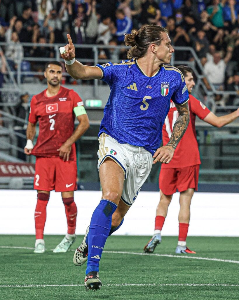 Italy defender Riccardo Calafiori, wearing No. 5, celebrating after scoring against Türkiye.