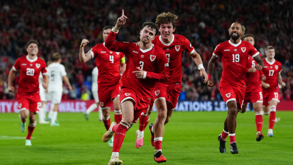 Wales defender Neco Williams celebrating after his side's winning goal.