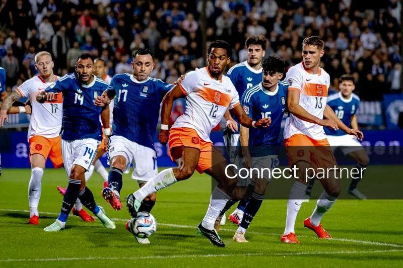 Netherlands defenders Jurrien Timber and Micky van de Ven with Greece's Manolis Saliakas and Thanasis Androutsos during the UEFA Nations League match at Toumba Stadium, Thessaloniki.