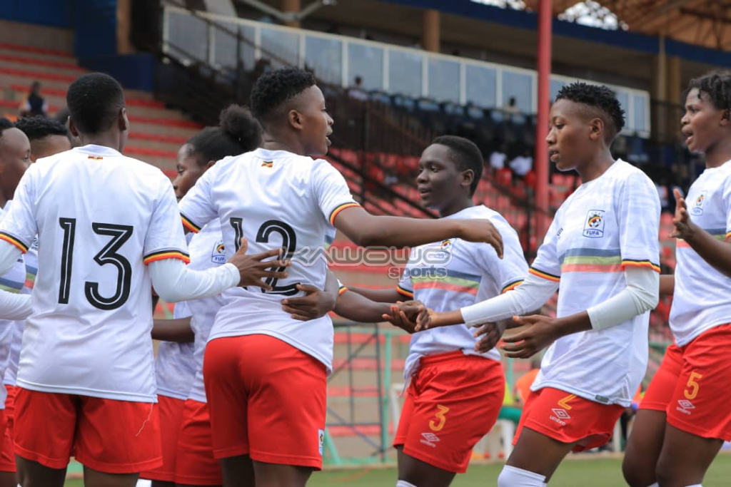 Uganda Crested Cranes players celebrating together after Riticia Nabbosa's goal.