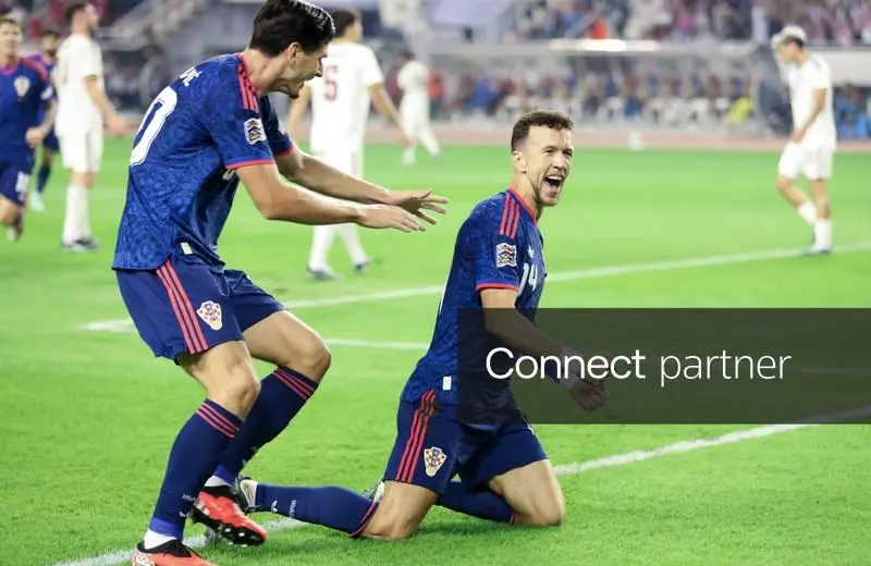 Croatia's Igor Matanović and Ivan Perišić celebrating after Perišić scored the opening goal against Spain at Stadion Poljud, Split.