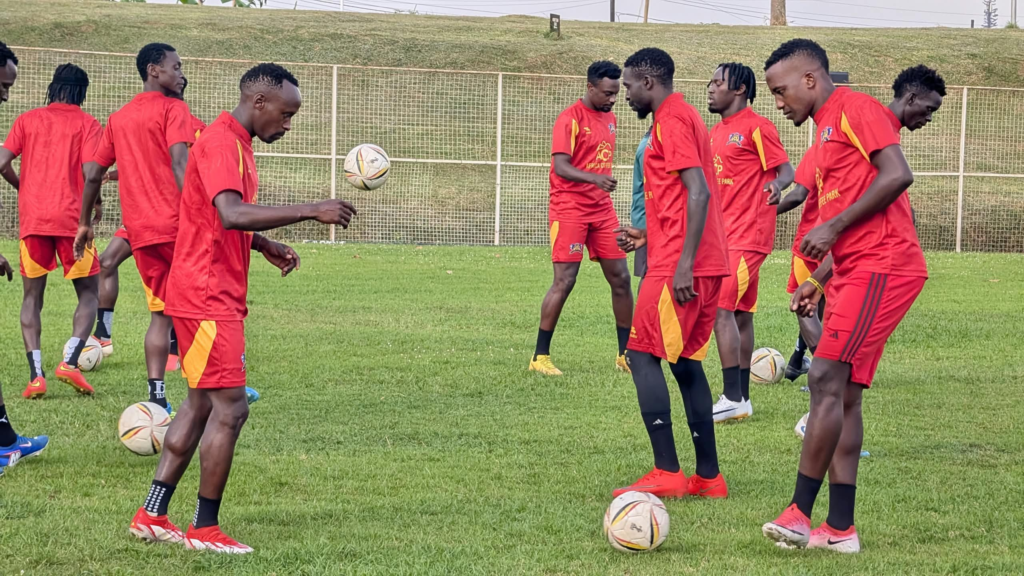 Mbarara City players in red training kits juggling balls during a training session ahead of their match against Ntugasaze FC.