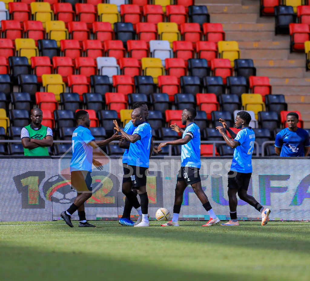 Gusto Mulongo celebrates alongside Vipers teammates after scoring.