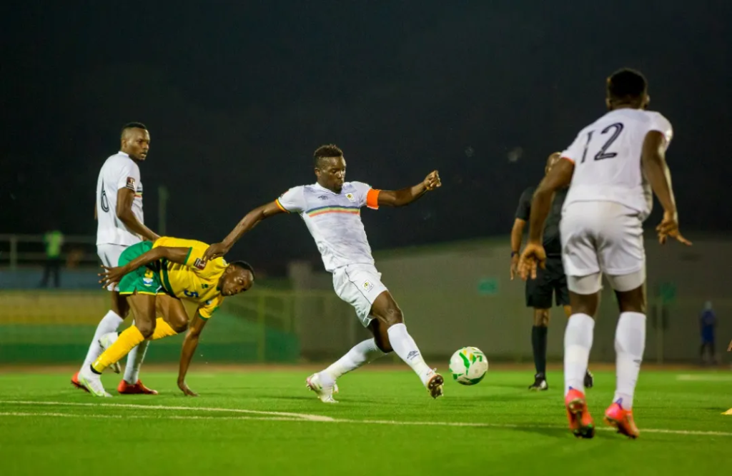 Khalid Aucho battles Rwanda opponents during Kigali encounter.