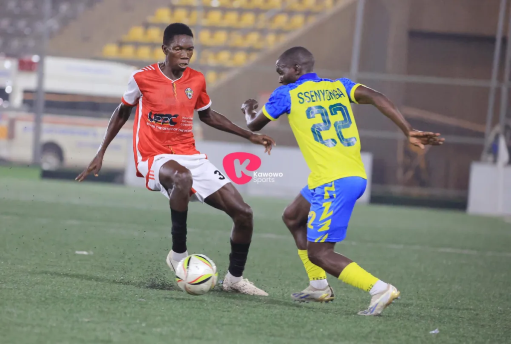 Thomas Ochungu in action with URA’s Mikidad Ssenyonga during a match.