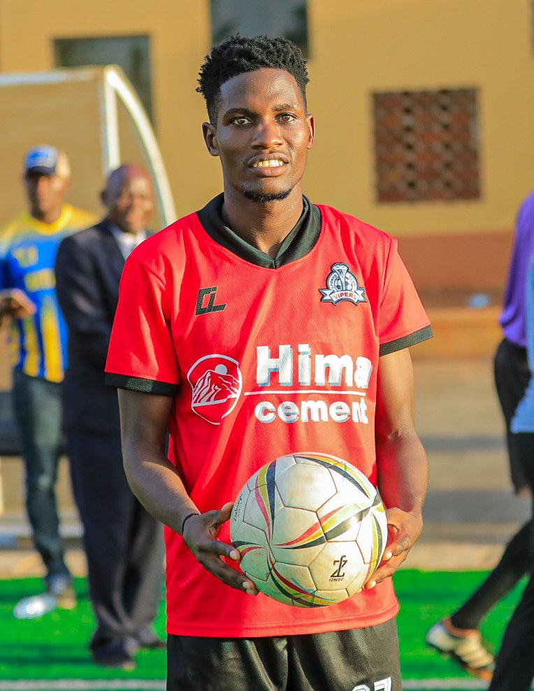 Vipers Sc Midfielder Usama Arafat walks away with the match ball after scoring a hattrick against Kataka FC