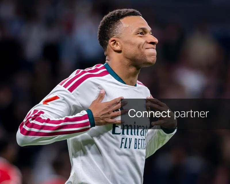 Kylian Mbappé celebrates scoring against Sevilla at Bernabéu.